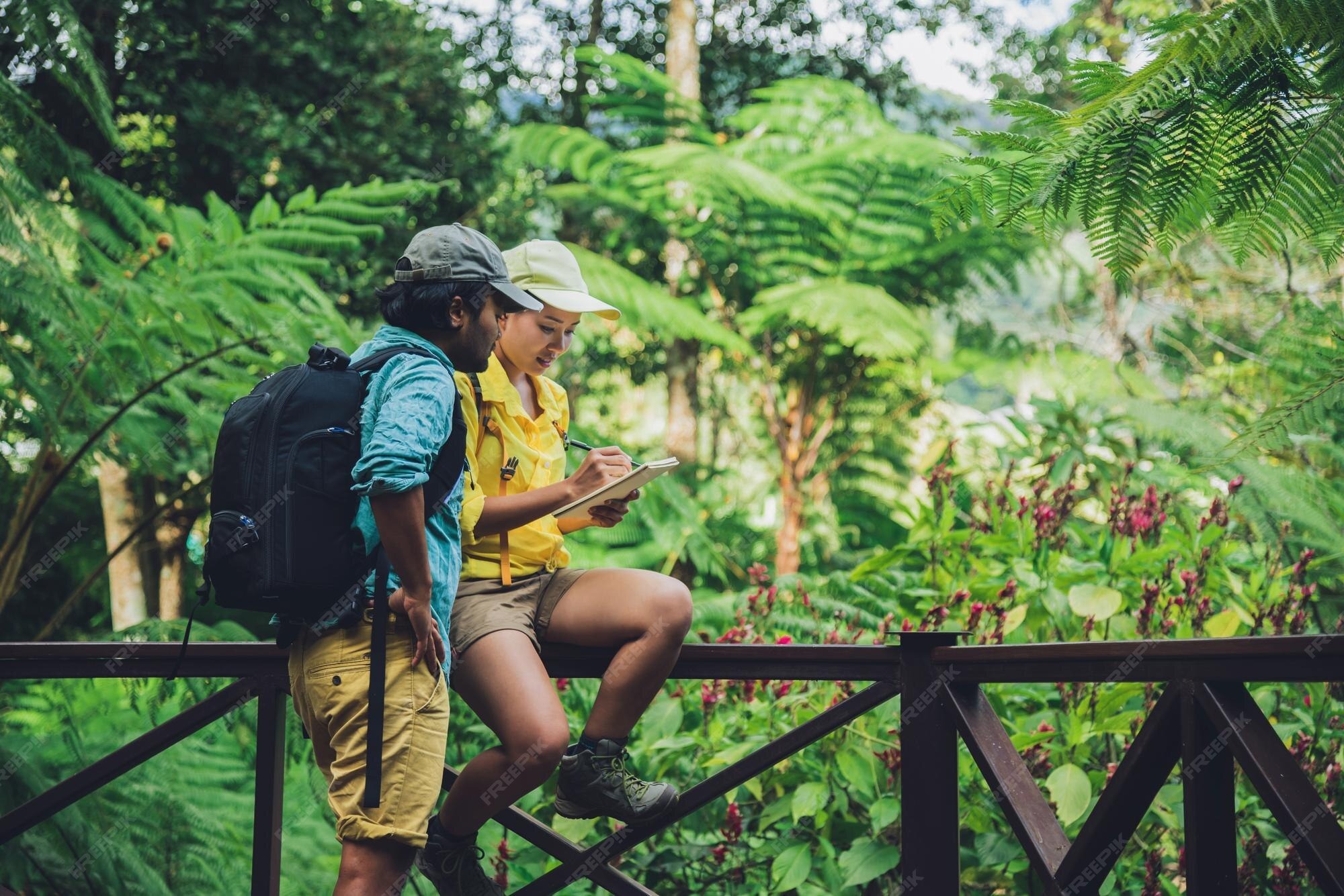 Couple enjoying a romantic forest getaway by a railing